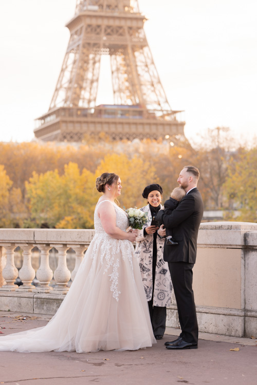 Paris elopement ceremony with baby at Eiffel Tower and marriage officiant