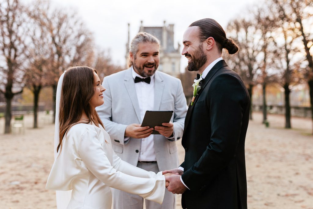 Marriage celebrant Marcus during ceremony with bride and groom eloping at Tuileries garden Paris